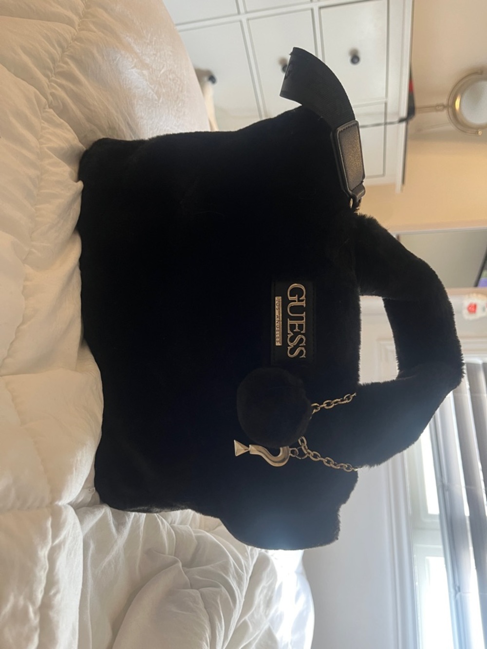 GUESS Plush Black Tote with Pom Charm and Logo Plate